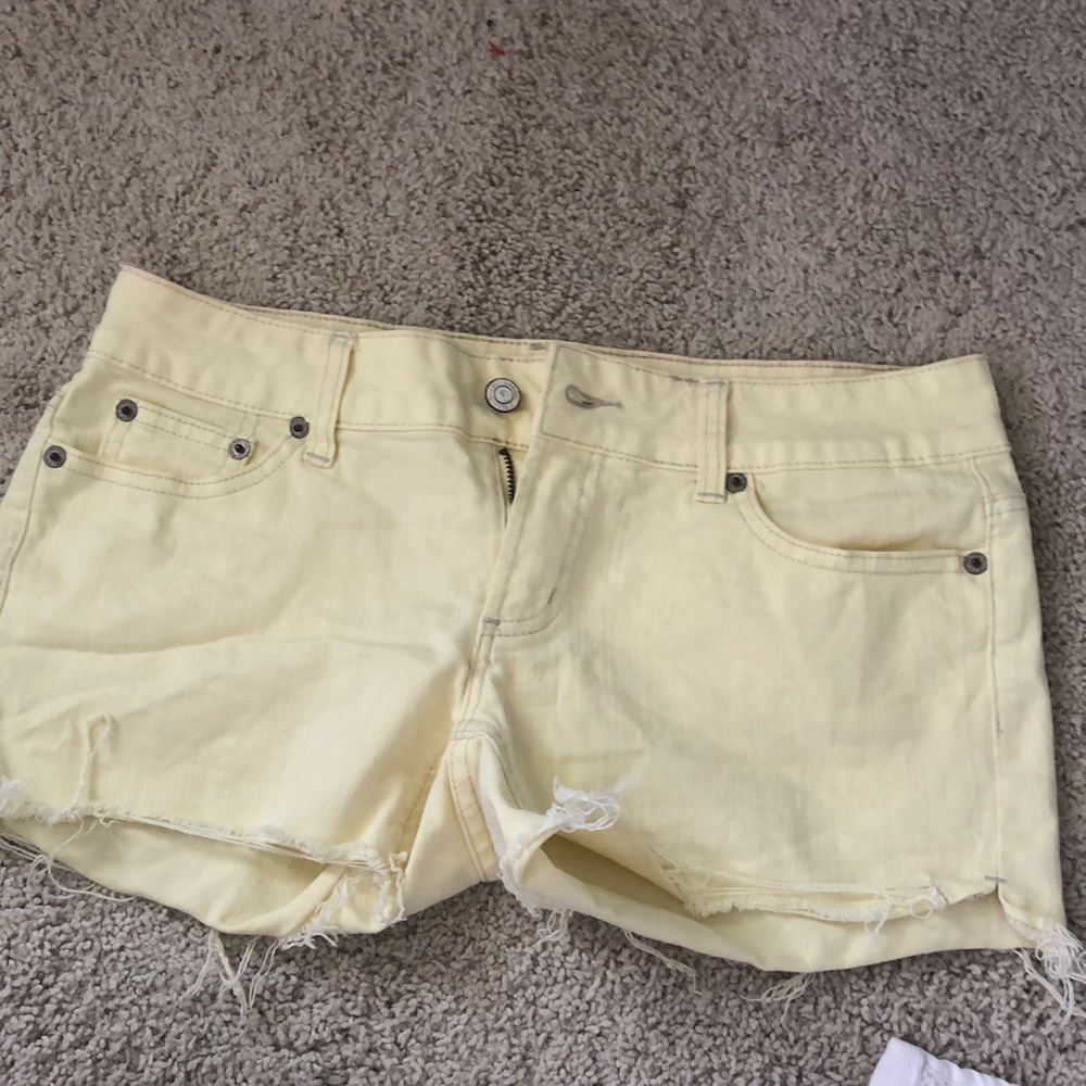 American eagle pale yellow cut off shorts